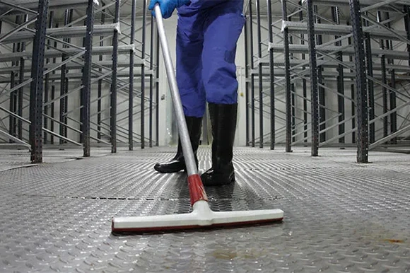 Surface and floor cleaning at industrial site in San Bernardino, CA for safety and hygiene.