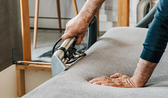 Couch cleaning specialist in Victorville, CA removing stains and allergens from upholstery.